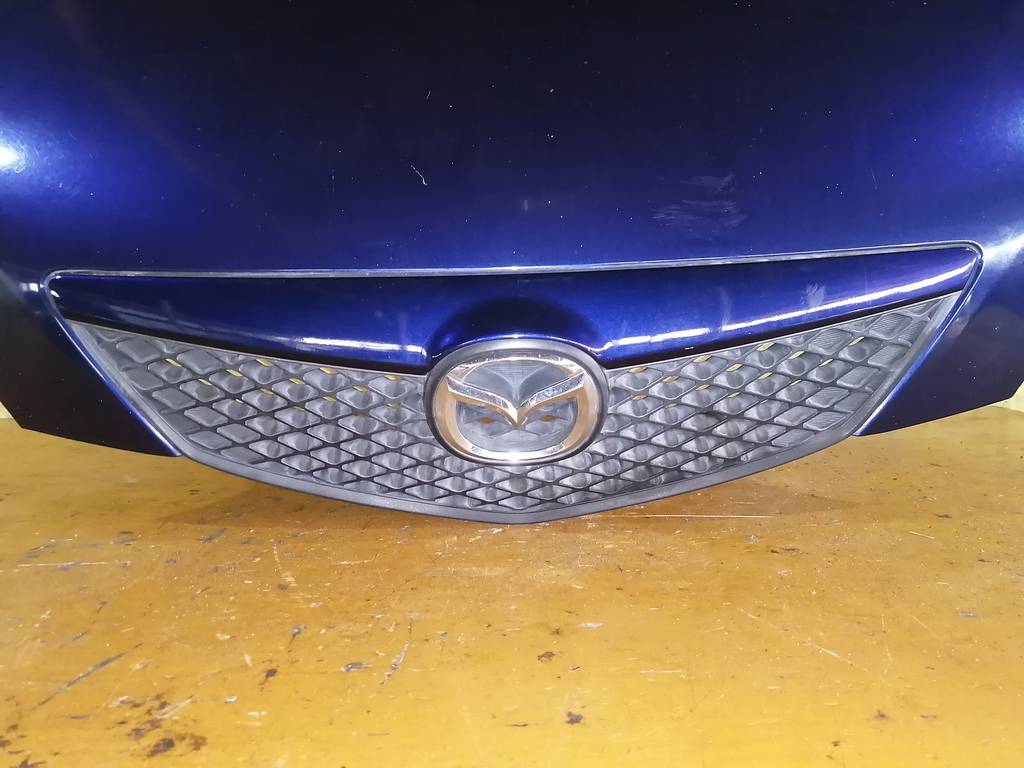 капот Mazda Demio