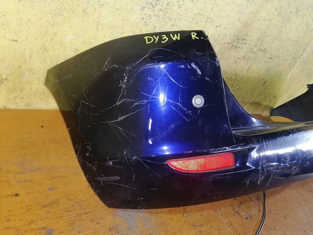 бампер Mazda Demio