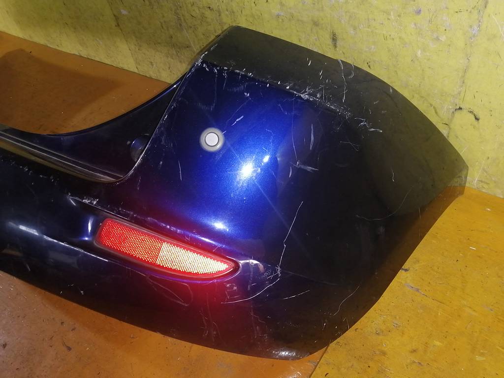 бампер Mazda Demio