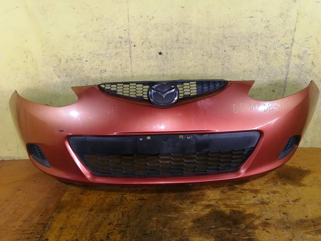 бампер Mazda Demio