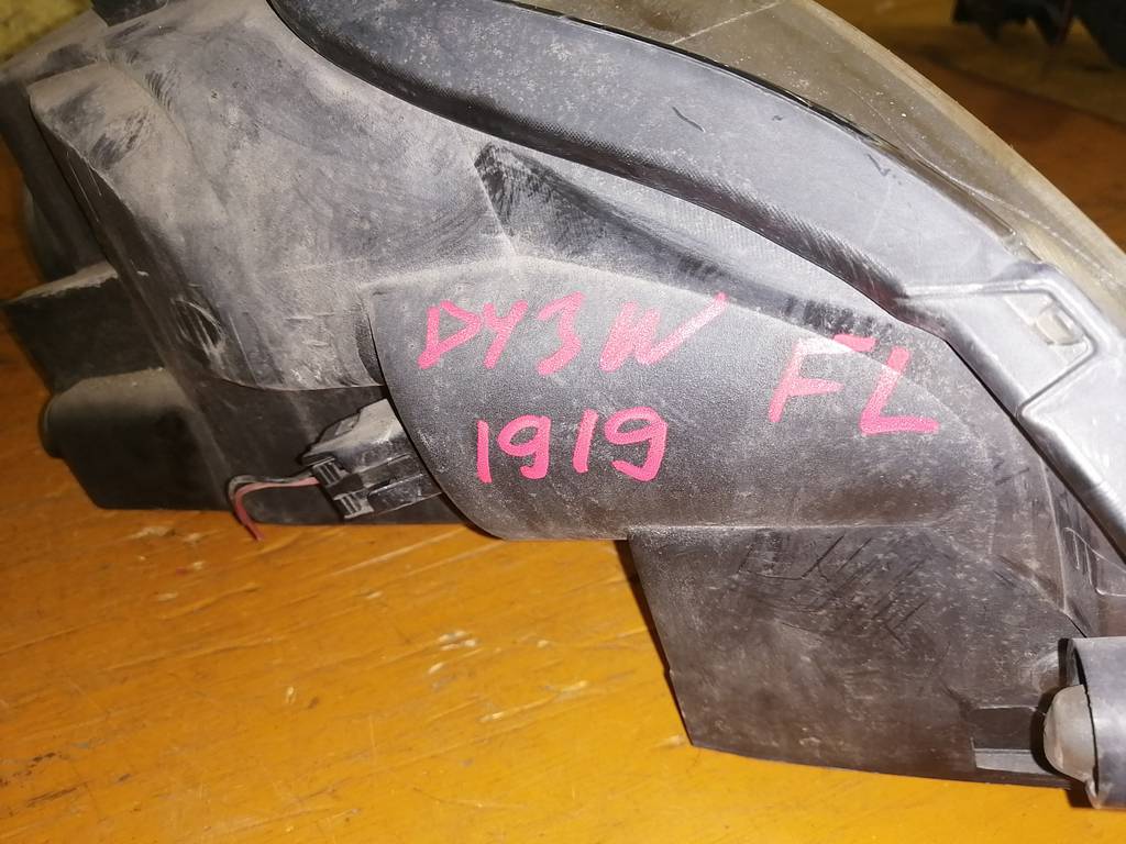 фара Mazda Demio