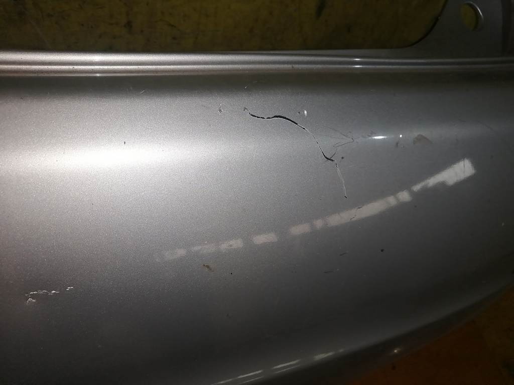 бампер Nissan Note