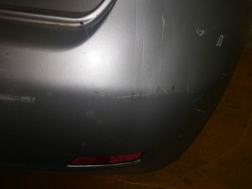 бампер Nissan Note