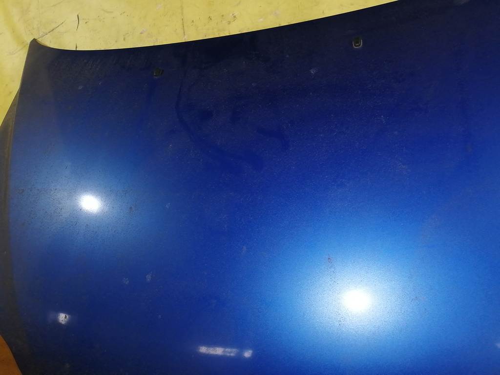 капот Mazda Demio