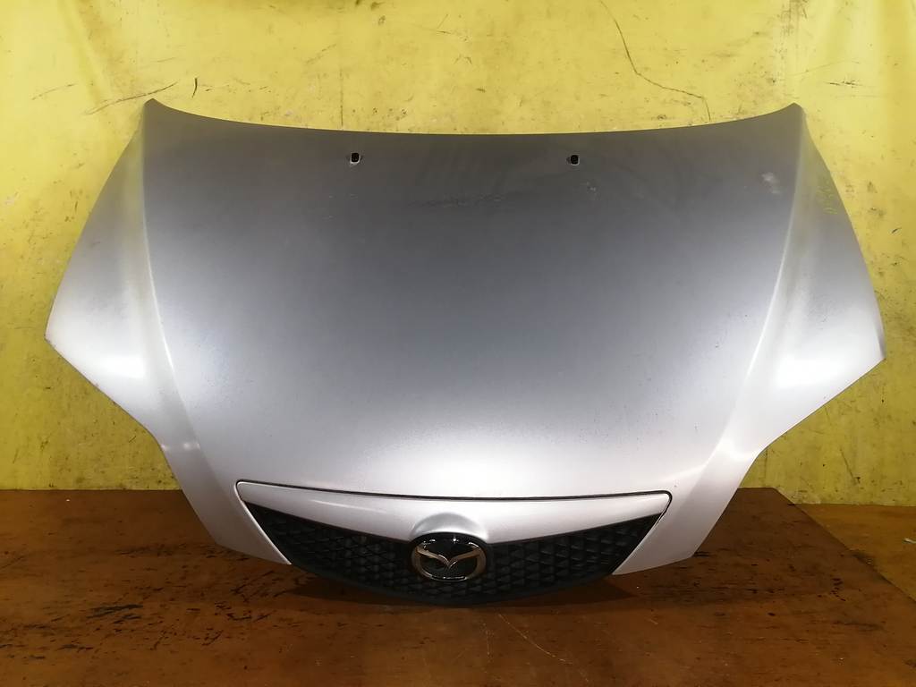 капот Mazda Demio