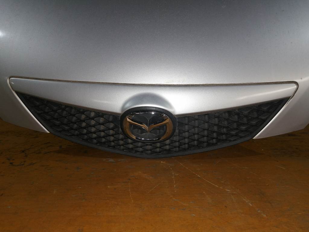 капот Mazda Demio