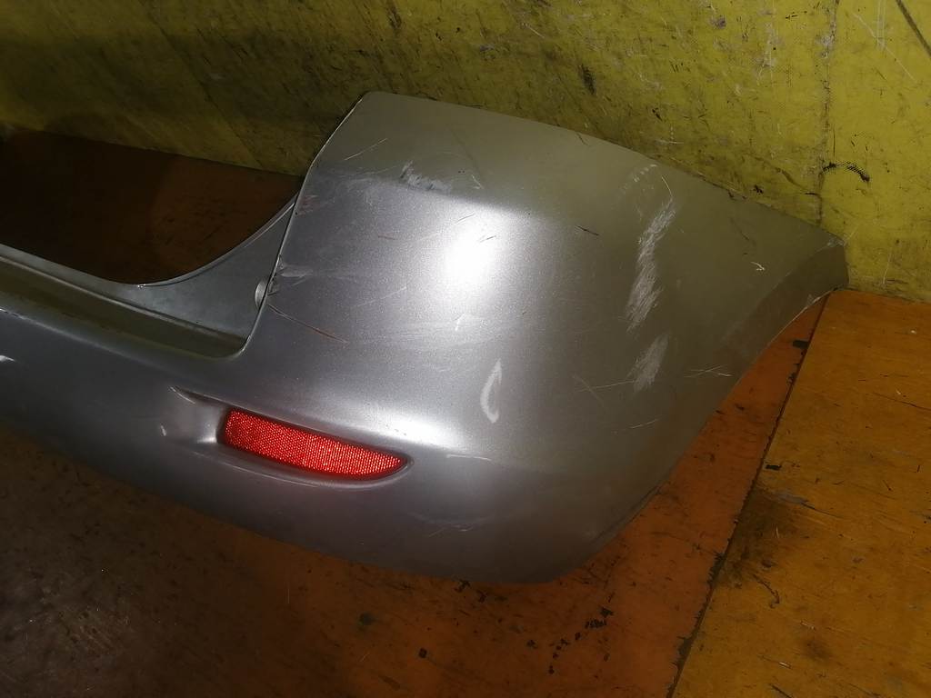 бампер Mazda Demio
