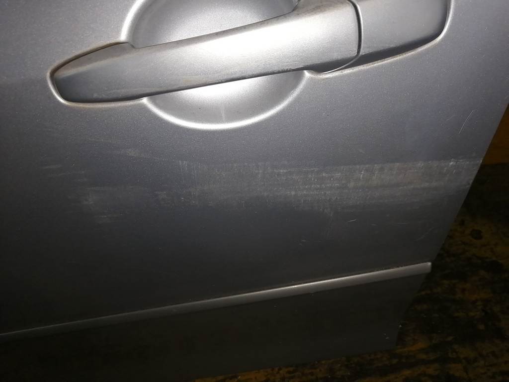 дверь Mazda Demio
