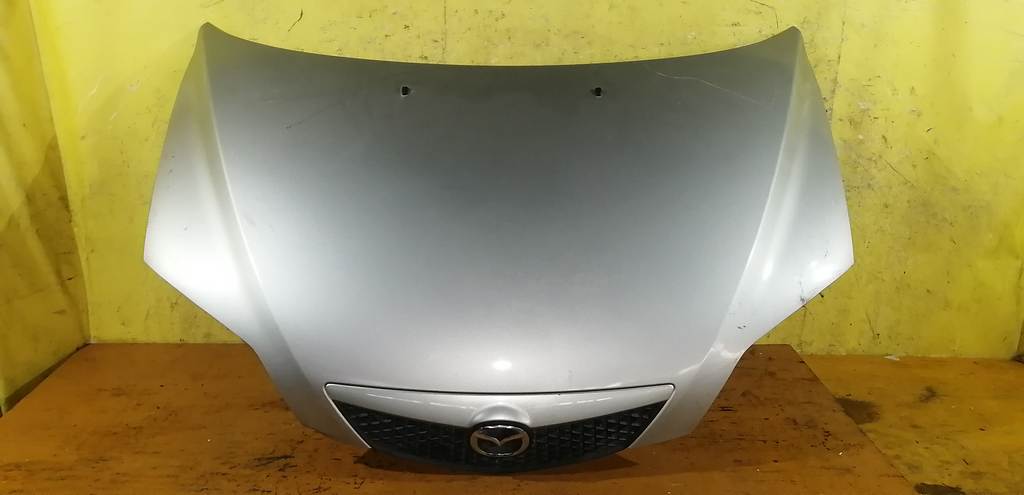 капот Mazda Demio
