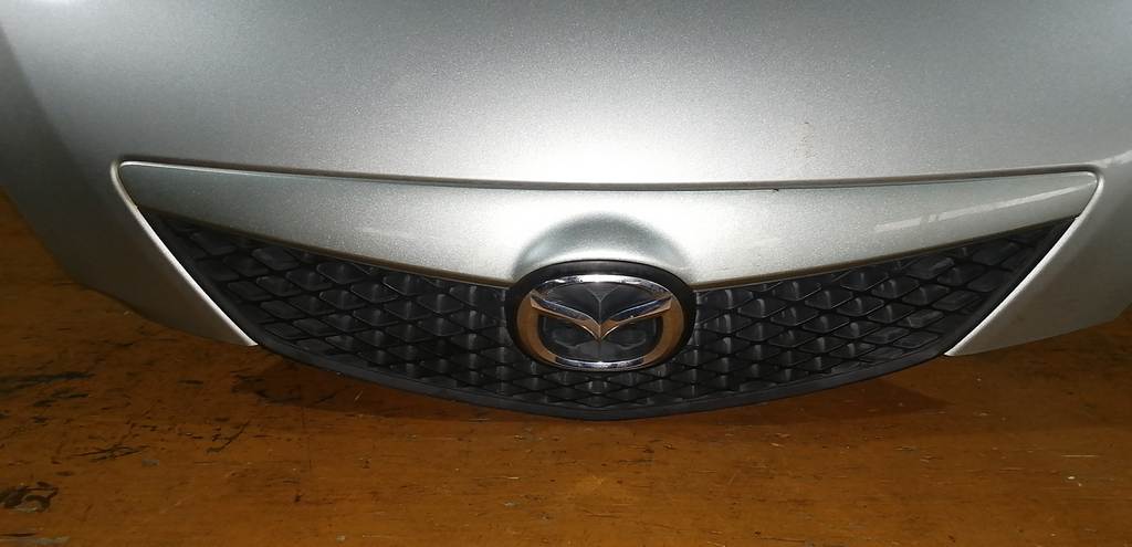 капот Mazda Demio