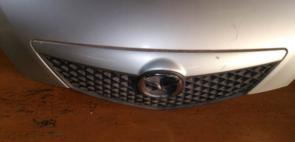 капот Mazda Demio