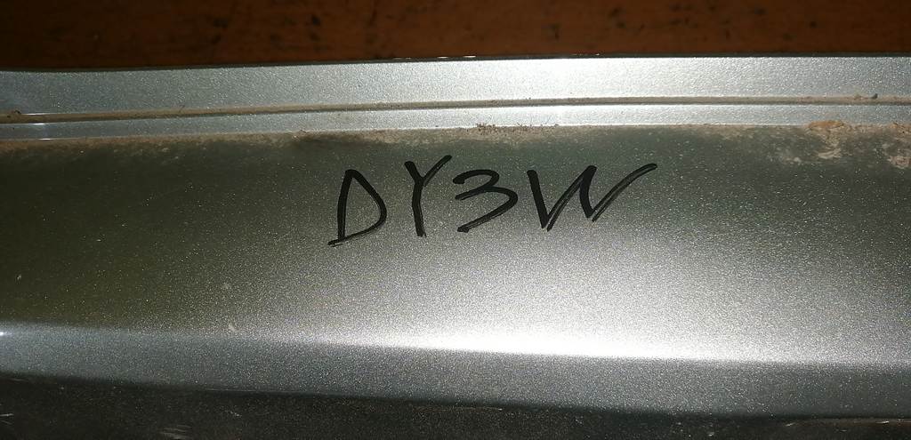 бампер Mazda Demio