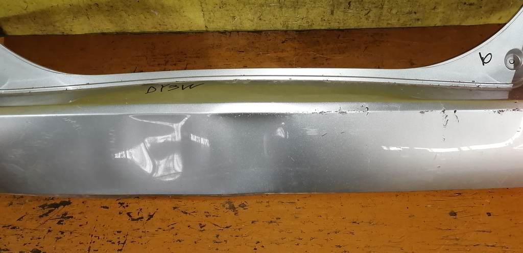 бампер Mazda Demio