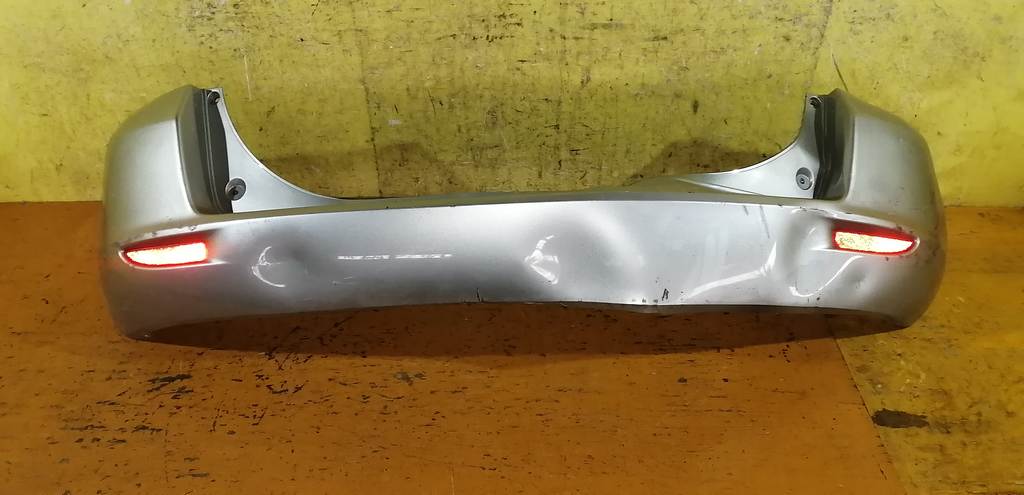 бампер Mazda Demio