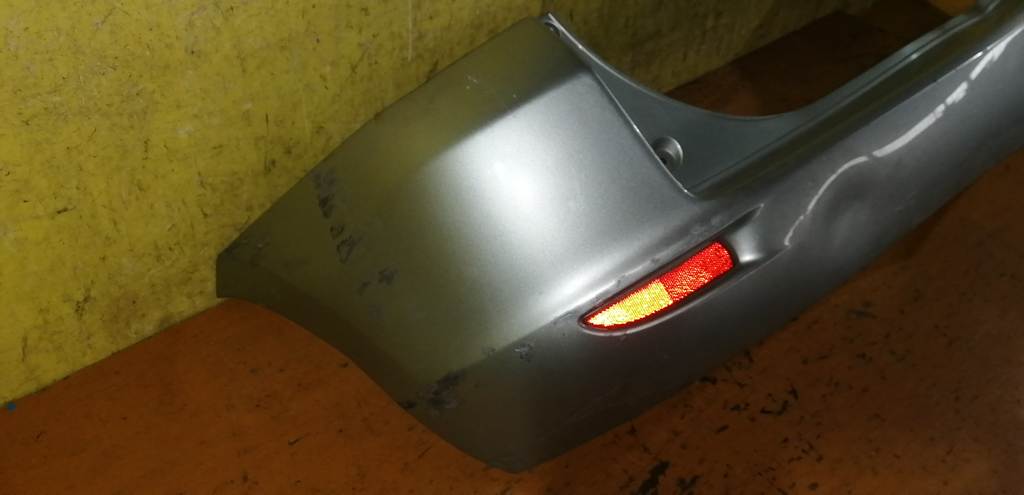бампер Mazda Demio