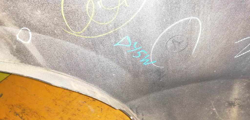 бампер Mazda Demio