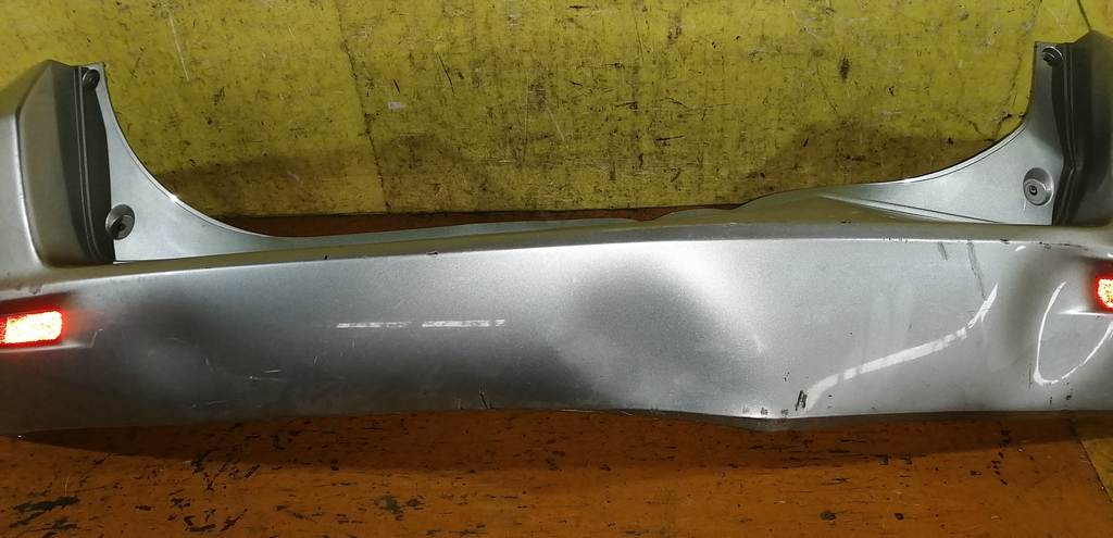 бампер Mazda Demio