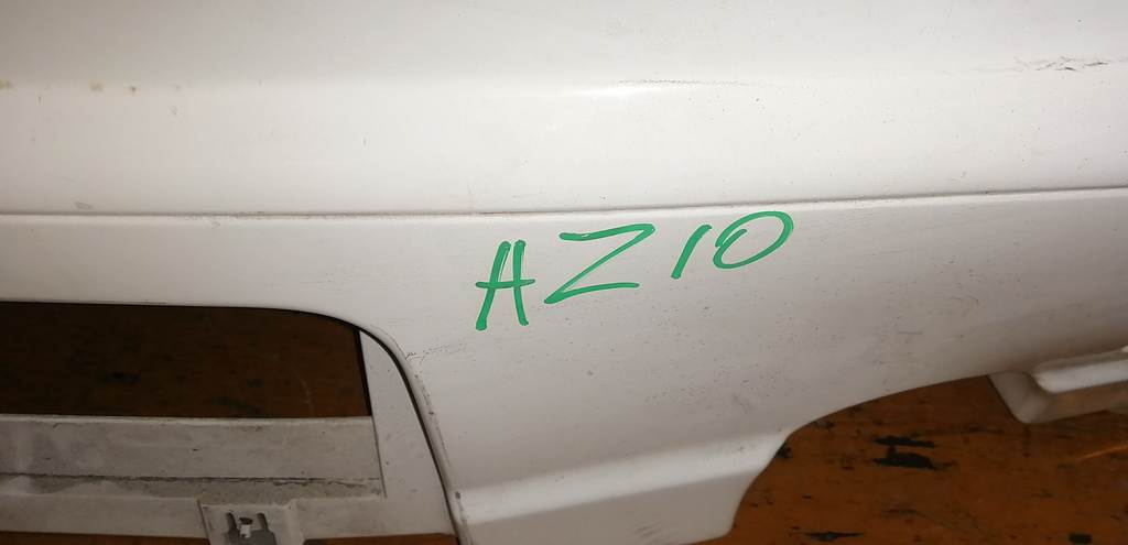 бампер Nissan Cube