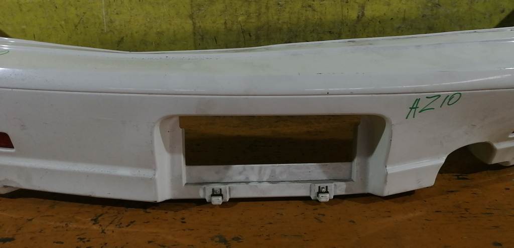 бампер Nissan Cube