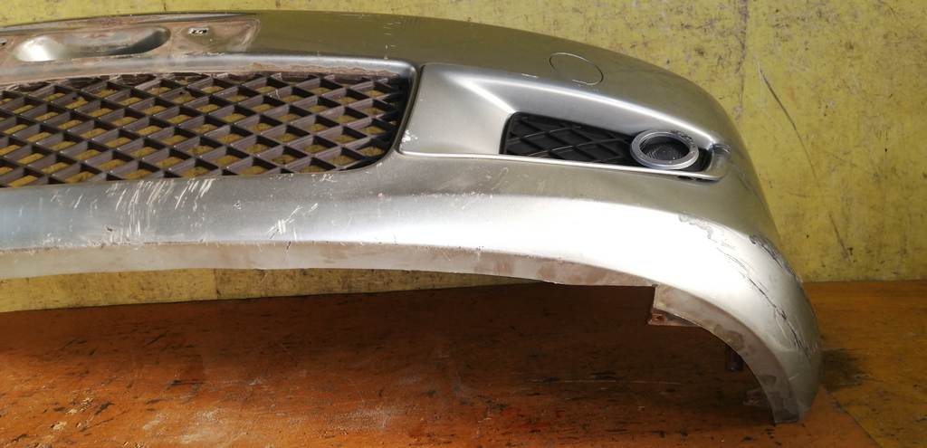 бампер Mazda Demio