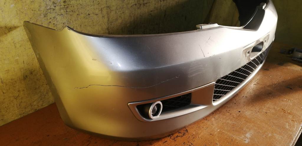 бампер Mazda Demio