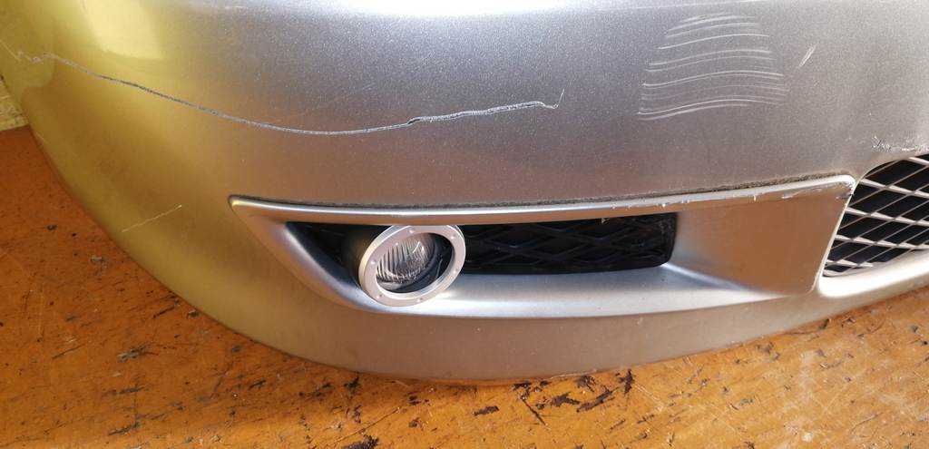 бампер Mazda Demio