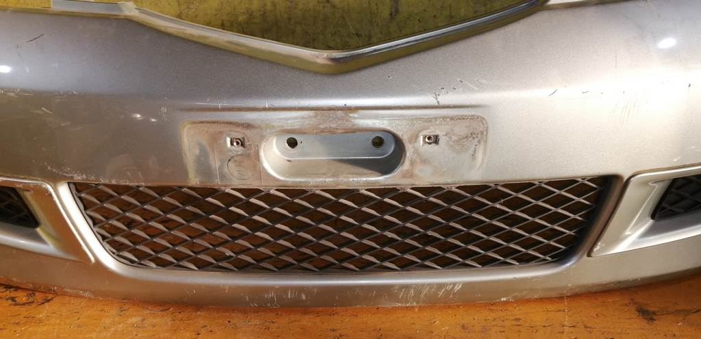 бампер Mazda Demio