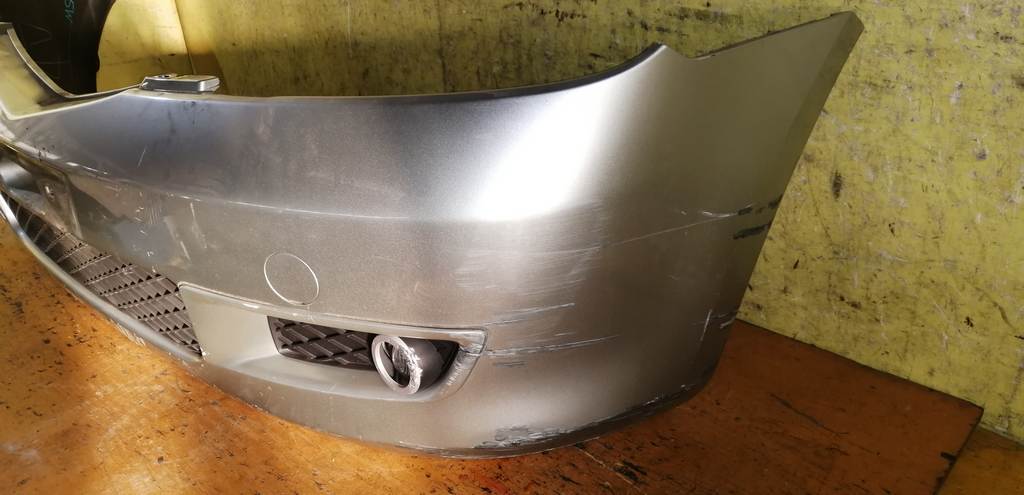 бампер Mazda Demio