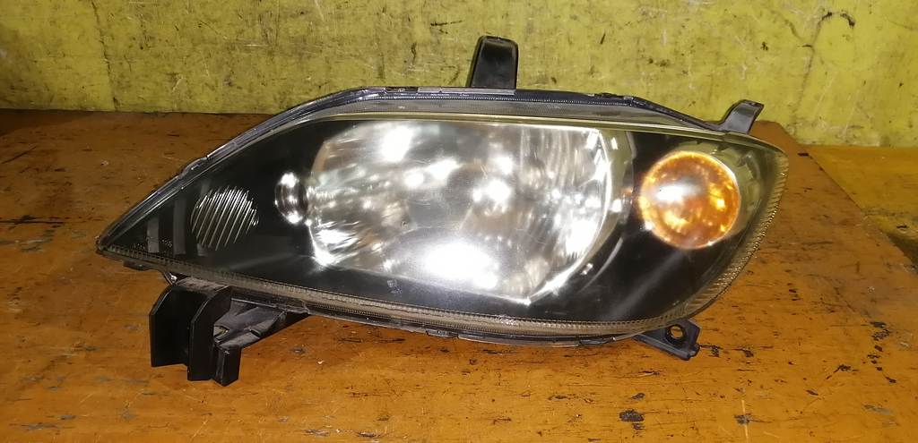 фара Mazda Demio