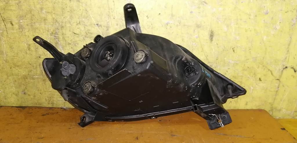 фара Mazda Demio