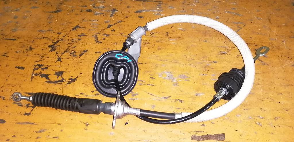 трос переключения акпп Honda Fit