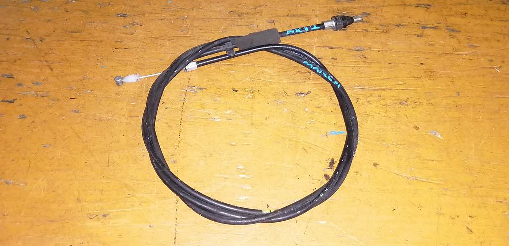 трос капота Nissan March