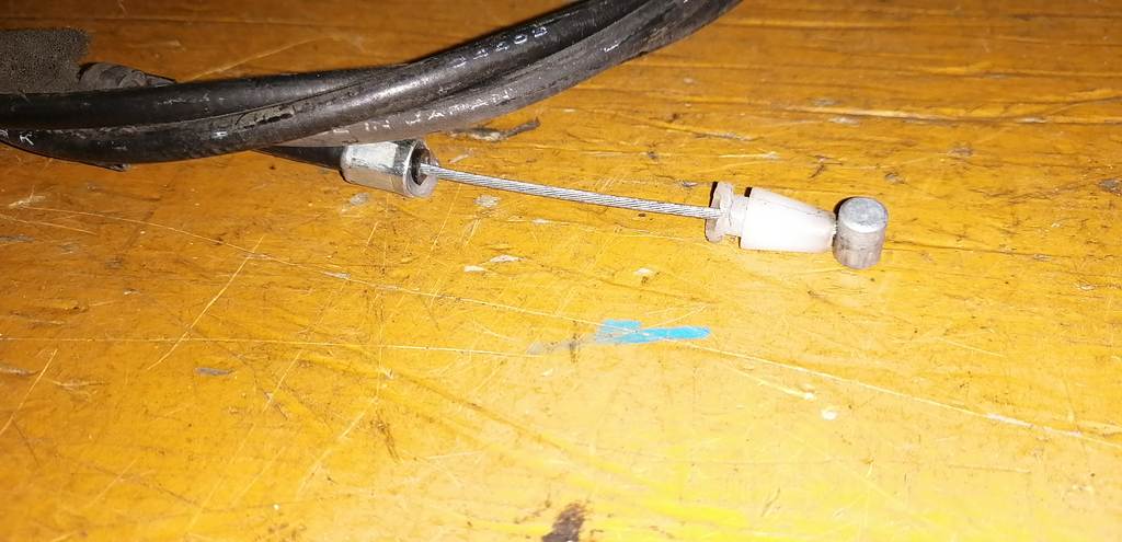 трос капота Nissan March