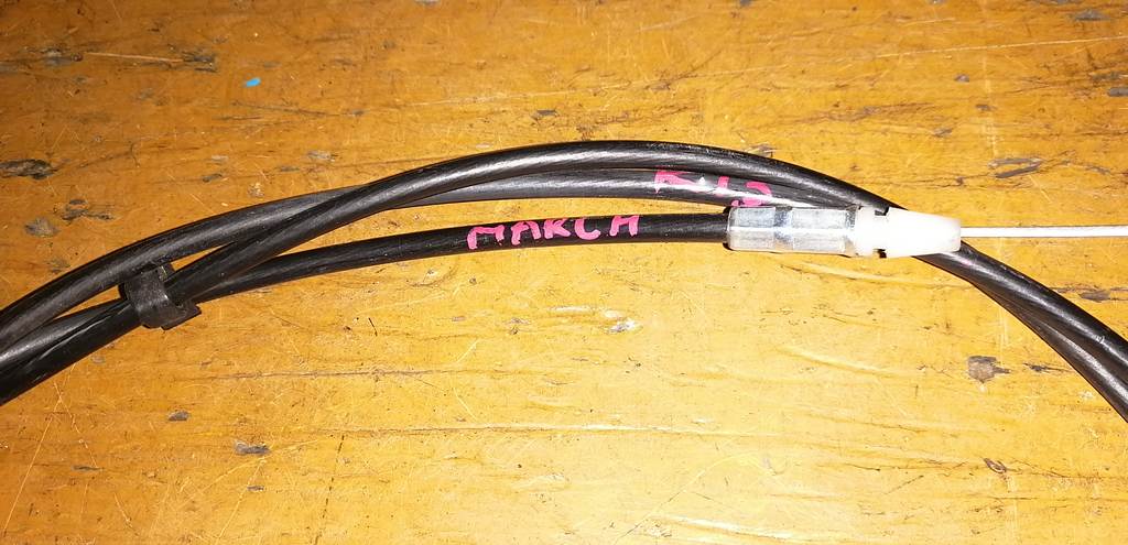 трос капота Nissan March