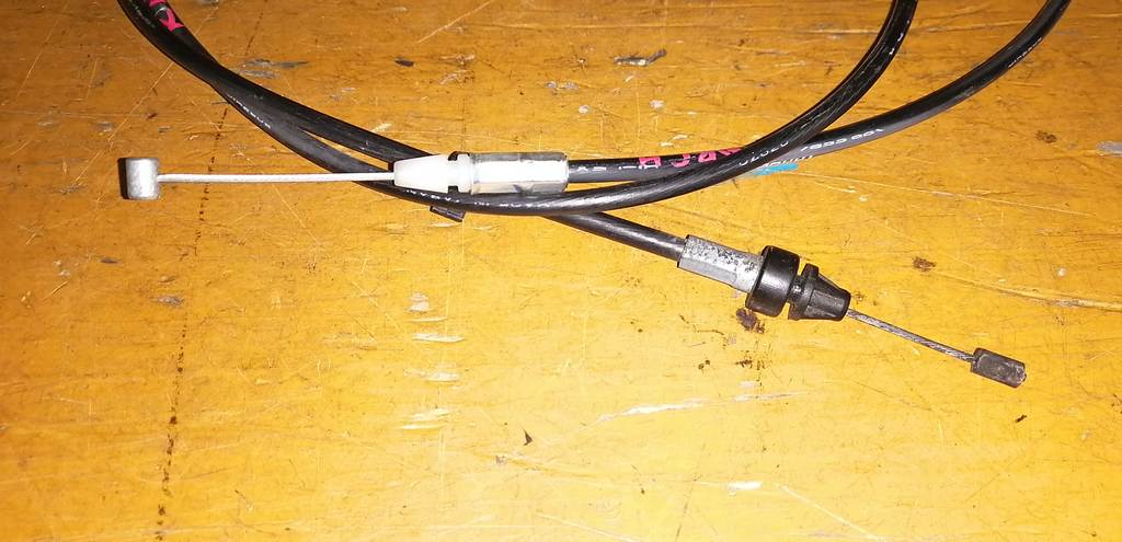 трос капота Nissan March