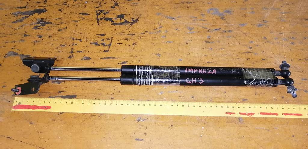 амортизатор двери Subaru Impreza