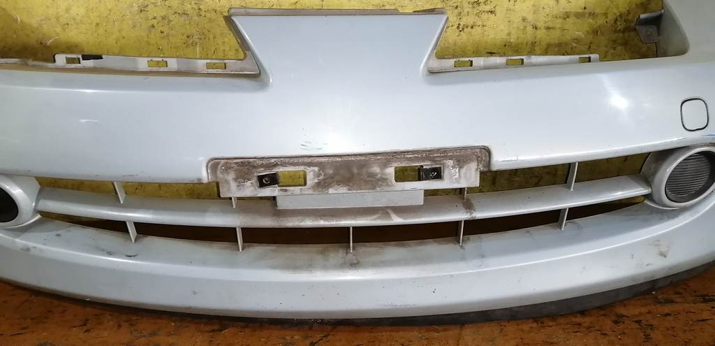бампер Nissan March