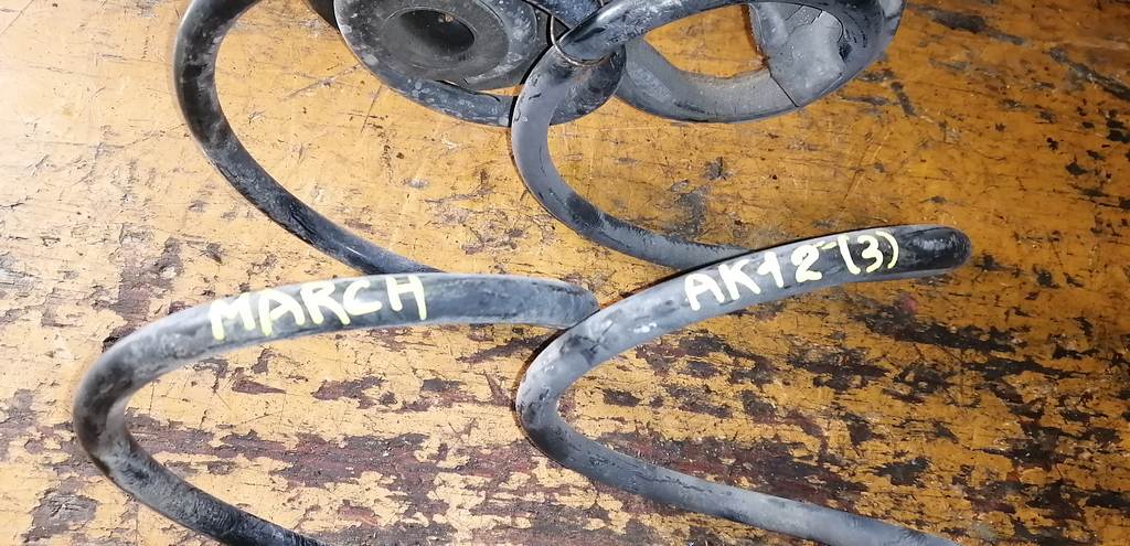 пружина Nissan March